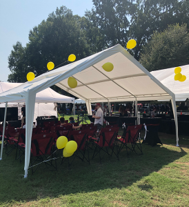 sober tailgate tent with yellow balloons